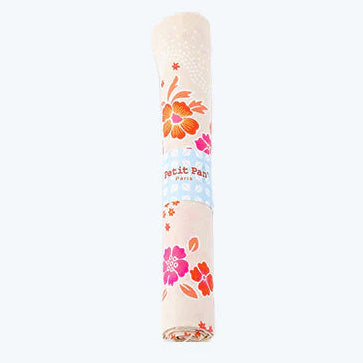 Rolled fabric with floral design on a white background