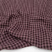 Close-up of purple checkered fabric on a white background