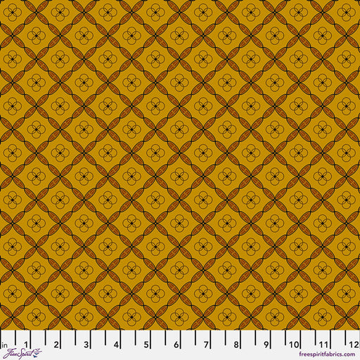 Patterned fabric swatch with a grid and floral design on a yellow background, featuring a ruler at the bottom.