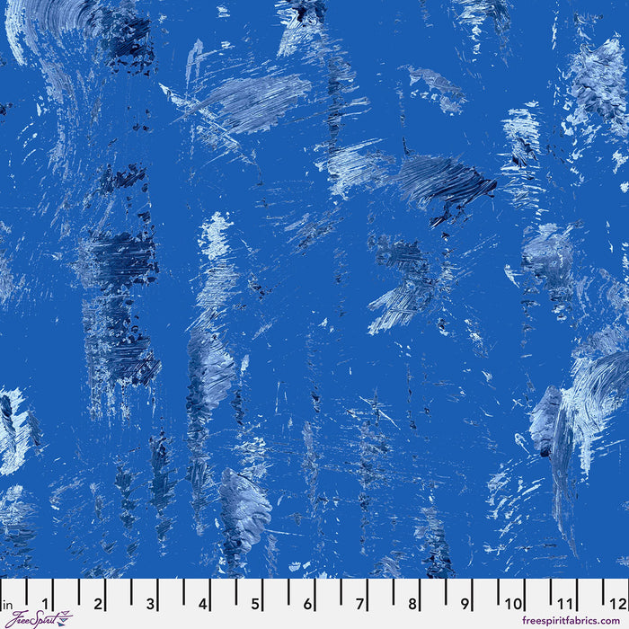 Blue fabric with abstract white and gray patterns, size ruler at the bottom.