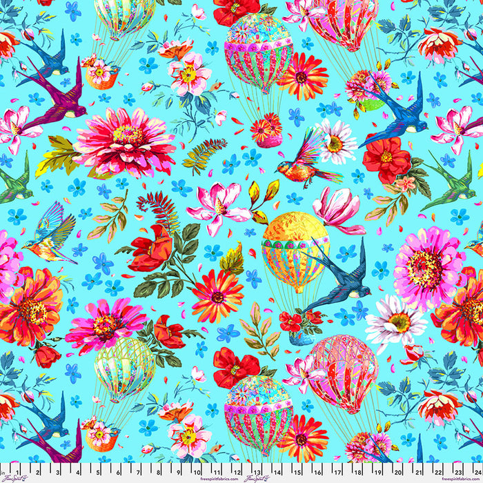 Colorful fabric pattern with flowers, hot air balloons, and birds on a blue background.