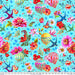 Colorful fabric pattern with flowers, hot air balloons, and birds on a blue background.