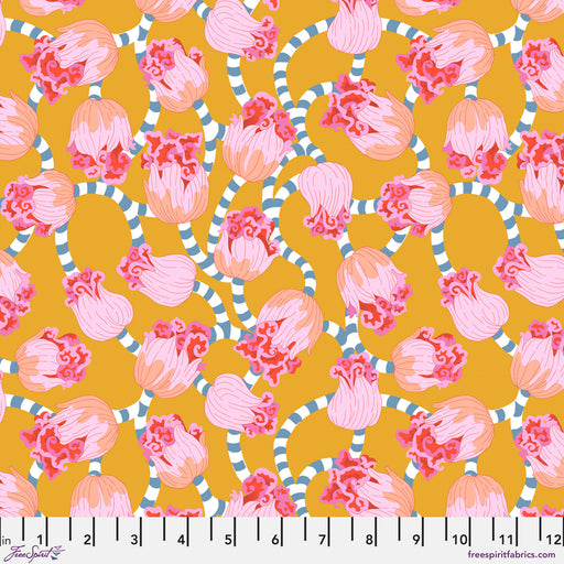 Pattern of pink and peach flowers with green leaves on a mustard yellow background, with a ruler at the bottom.