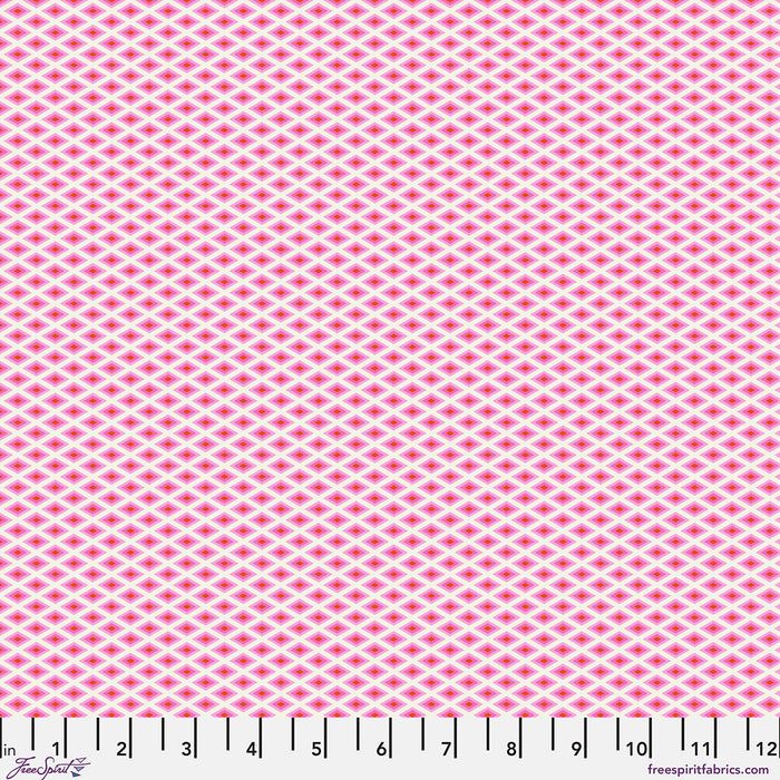 Pink fabric with a small geometric pattern, brand 'Free Spirit' visible
