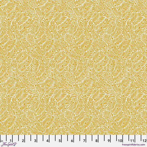 Yellow fabric pattern with a ruler at the bottom for scale