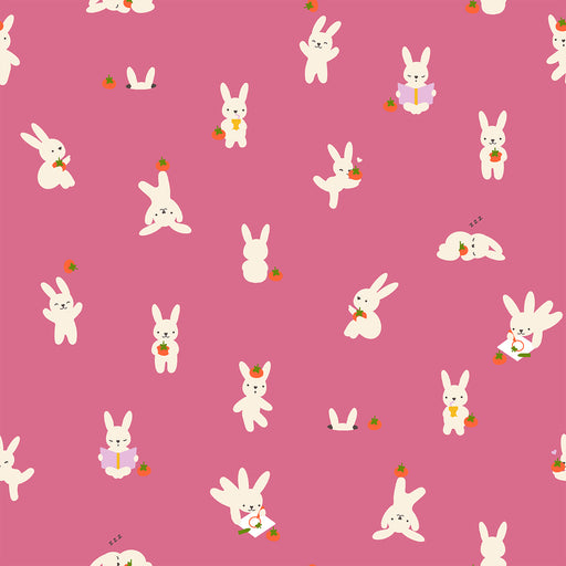 Pattern of white cartoon bunnies with carrots on a pink background