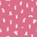 Pattern of white cartoon bunnies with carrots on a pink background