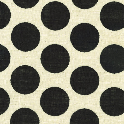 Pattern of black circles on a beige background