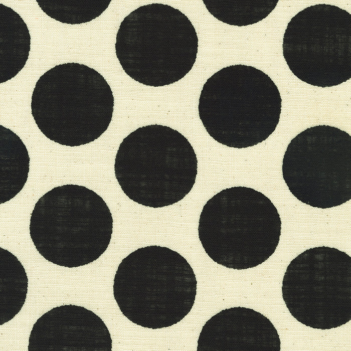Pattern of black circles on a beige background
