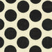 Pattern of black circles on a beige background