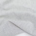 Close-up of gray striped fabric with a white background