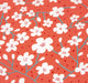 Pattern of white flowers on a red background with blue stems
