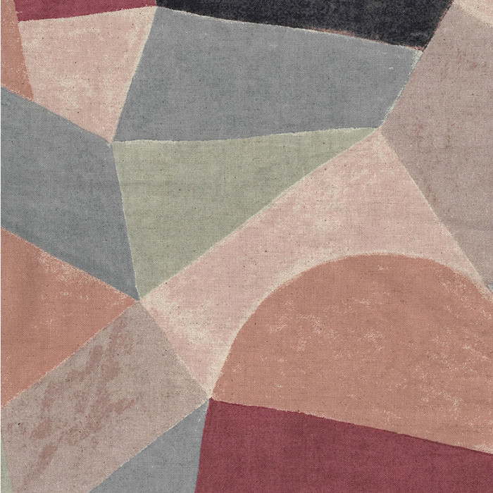 Abstract geometric fabric closeup with a modern mosaic pattern in muted dusty pink, sage green, slate gray, burgundy, and charcoal tones.