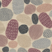 A close-up of a patterned fabric featuring organic, pebble-like shapes in dusty pink, mauve, slate blue, charcoal, and cream on a textured off-white background.
