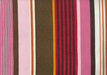 close up of striped fabric, with pinks, reds, and browns in varying width stripes.