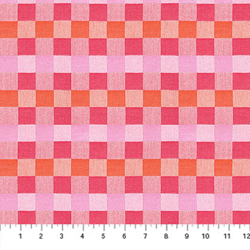 Checkered fabric pattern with pink and orange squares, measured against a ruler.