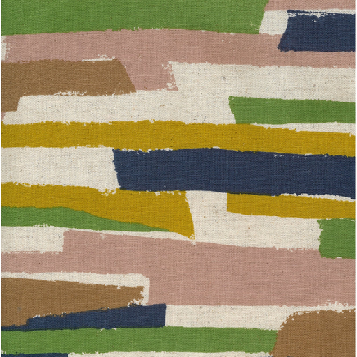 close up of fabric with paint strokes running horizontally in mustard, navy, dusty pink, and army green