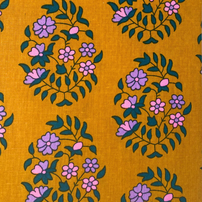 Fabric with floral pattern on a yellow background