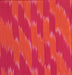 Close up of Ikat Woven Cotton in Orange and Fuchsia 