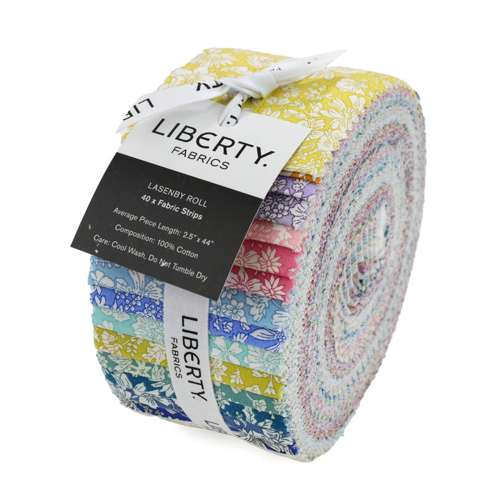 Roll of Liberty Fabrics with colorful fabric strips and a visible label.